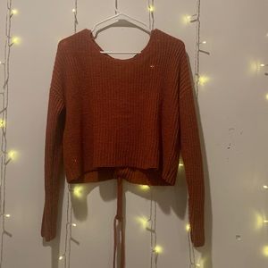 Burnt Orange crop sweater with tie in back. Size small.